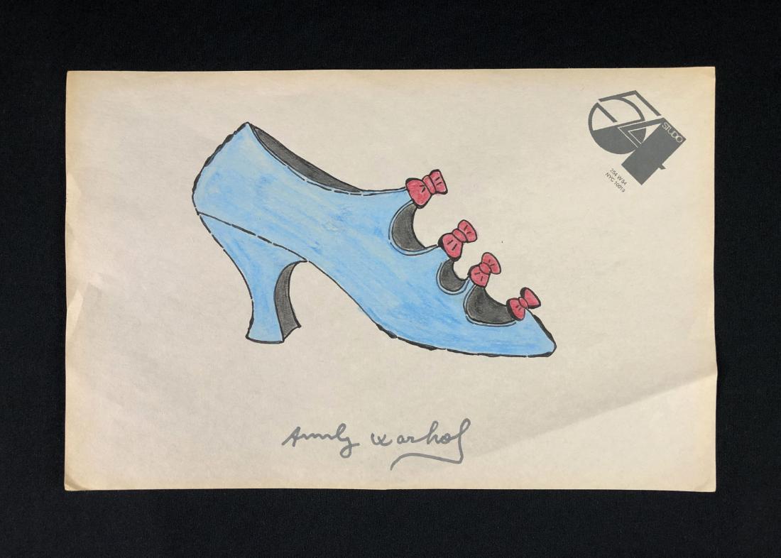 In the style of Andy Warhol-- Hand Drawn Mixed: This lot consists of a hand drawn mixed media (crayon and ink) on paper, "Andy Warhol". Image depicts a side view of a blue, high-heeled ladies shoe, lined with bright pink bows. Done on letterhead be