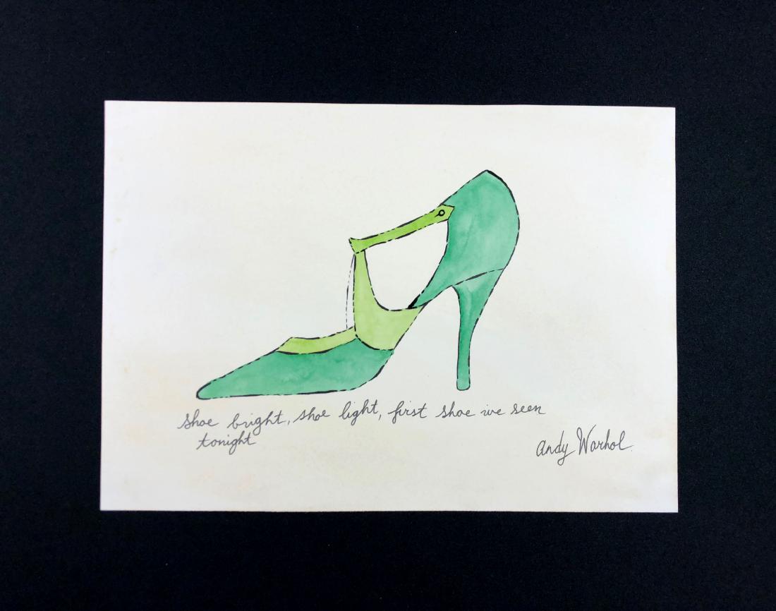 In the style of Andy Warhol-- Hand Drawn Mixed: This lot consists of a hand-painted mixed media (ink and watercolor) on paper, "Andy Warhol" at bottom right corner. Handwritten inscription below the image reads, "Shoe bright, shoe light, first shoe
