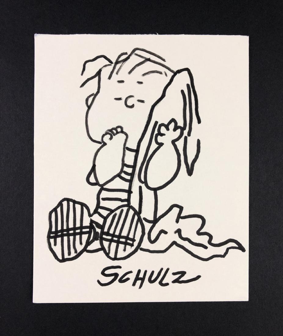 Charles Schulz (American, 1922-2000) - Ink Drawing: This lot consists of a hand-drawn ink illustration on heavy paper, attributed to the famed cartoonist Charles Schulz (American, 1922-2000). "Schulz" is hand written at bottom. Image depicts Linus van 
