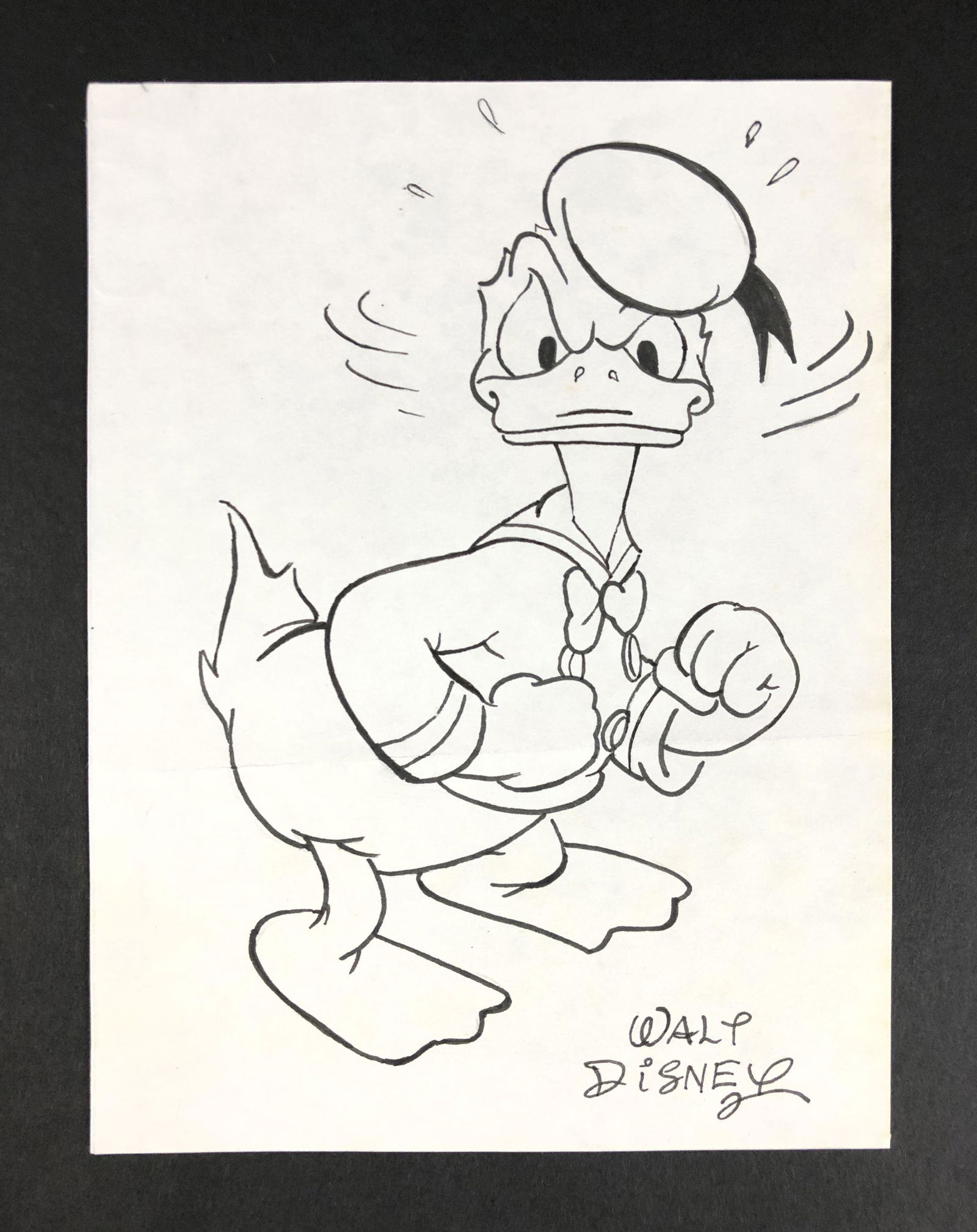 Walt Disney (American, 1901-1966) - Ink on Paper: This lot consists of an ink illustration on paper, done in the distinct cartoon style of Walt Disney (American, 1901-1966). Image depicts Disney's familiar cartoon character, Donald Duck, looking toug