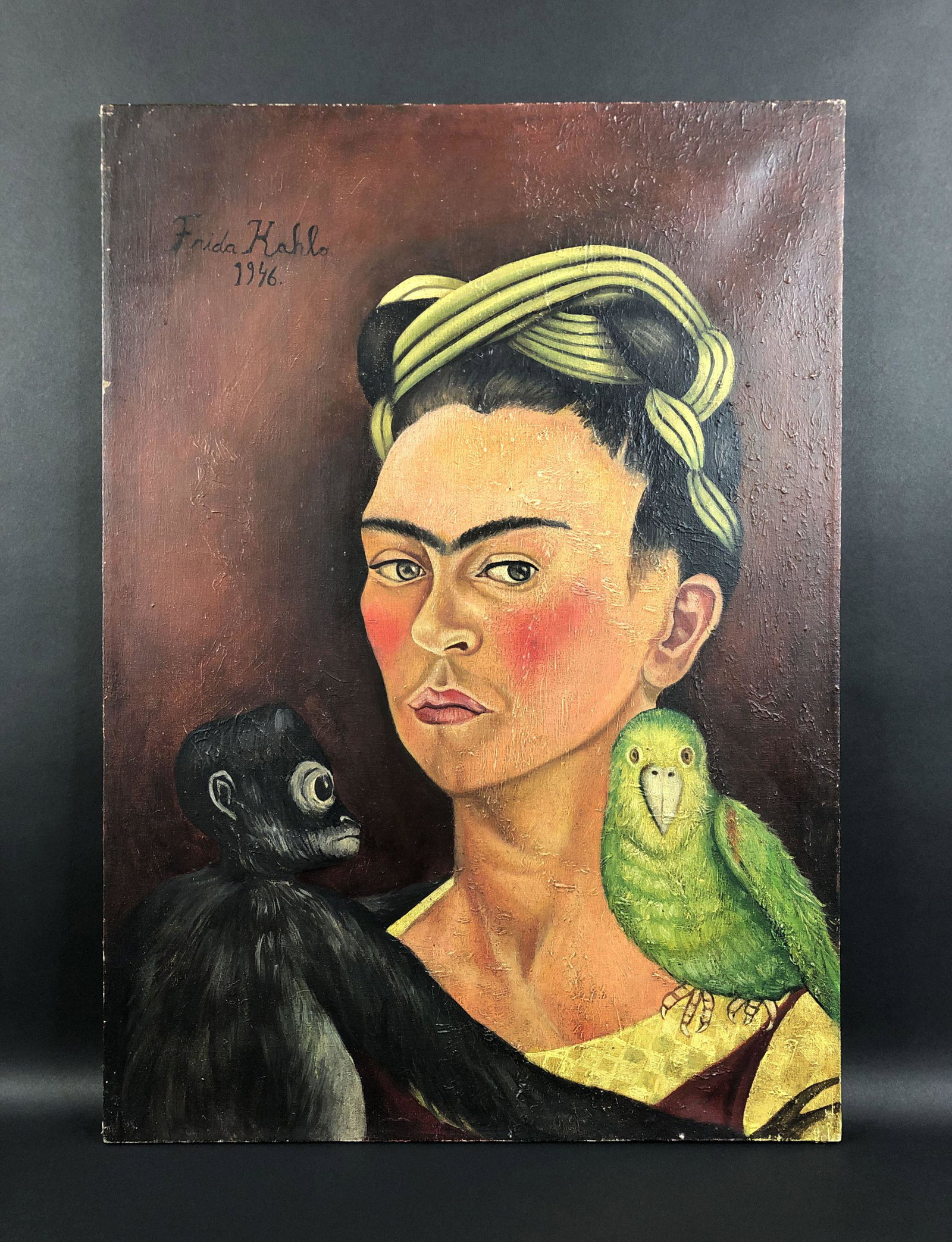 Frida Kahlo (Mexican, 1907-1954) - Oil on Canvas: This lot consists of an oil painting on canvas, done in the modern style of Frida Kahlo (Mexican, 1907-1954). "Frida Kahlo" is hand painted at top left along with the date "1946". This beautifully det