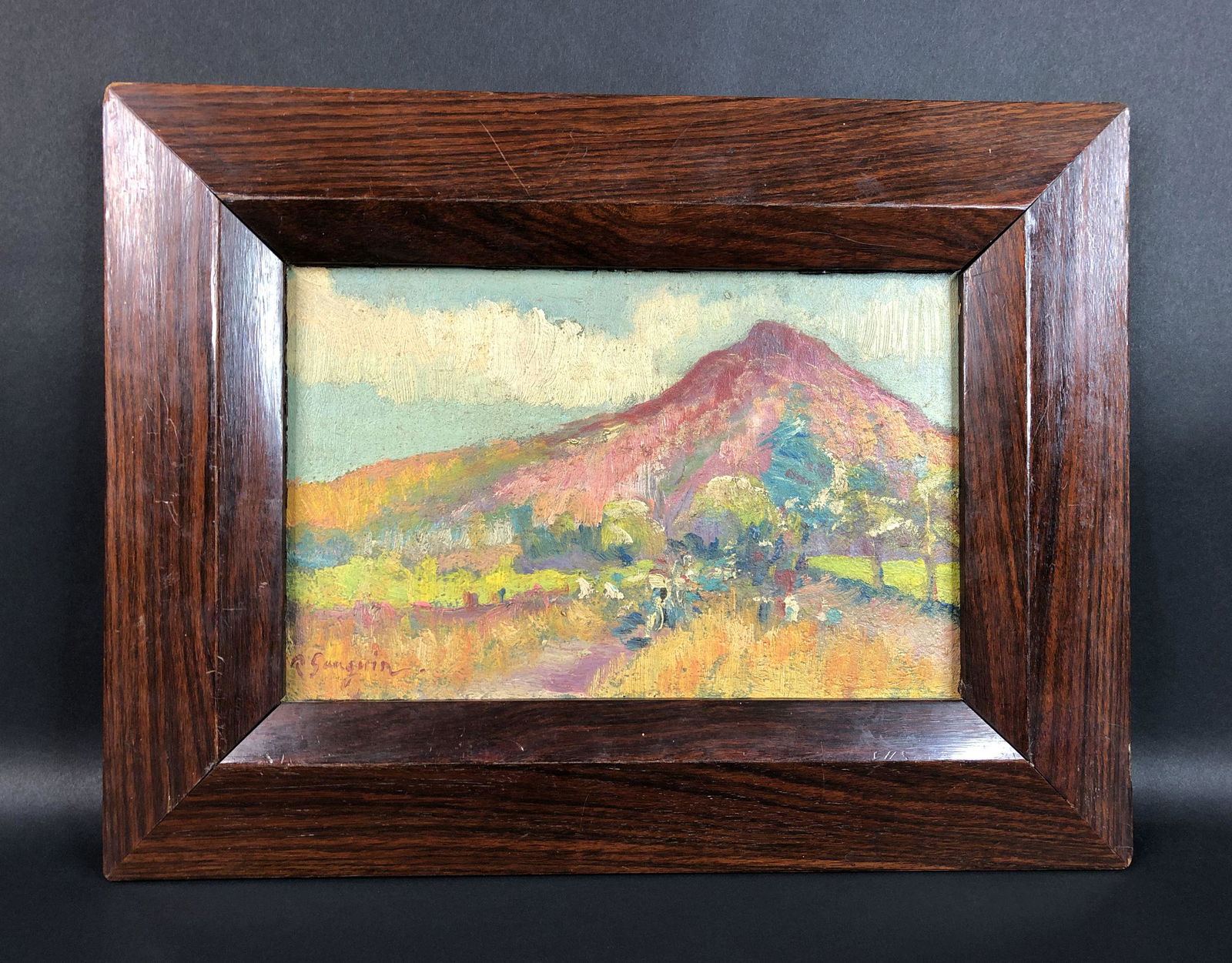 Paul Gauguin - Oil on Canvas (style of): This lot consists of a framed oil painting on canvas, done in the Post-Impressionist style of Paul Gauguin (French, 1849-1903). Image depicts a glimmering mountain, draped in lush sunlight and deep fo