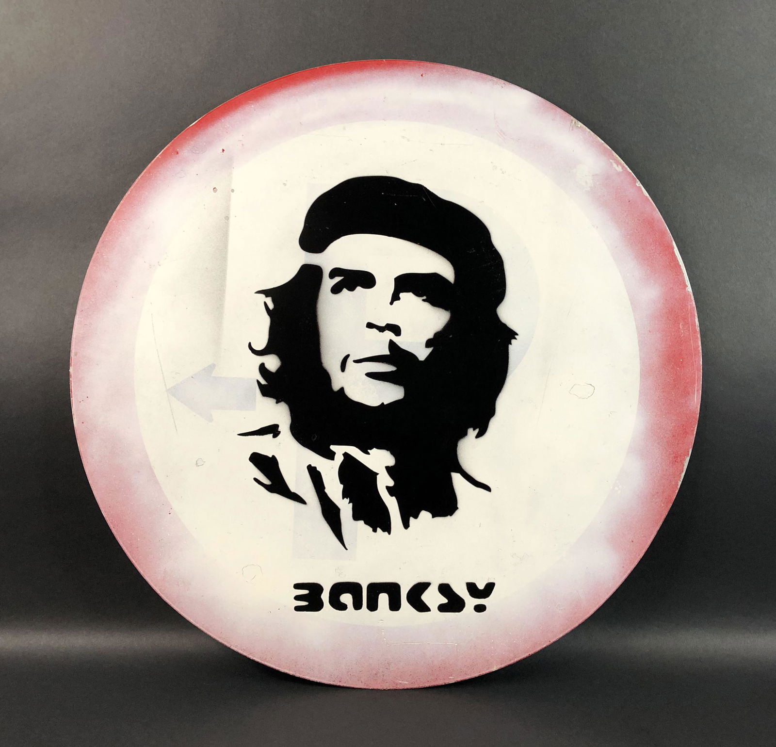 Banksy - Aerosol/Metal (style of): This lot consists of a stencil painting on a repurposed street sign, done in the style of street artist Banksy (British, 1974 -). Image depicts the revolutionary Marxist leader, Che Guevara (Argentine