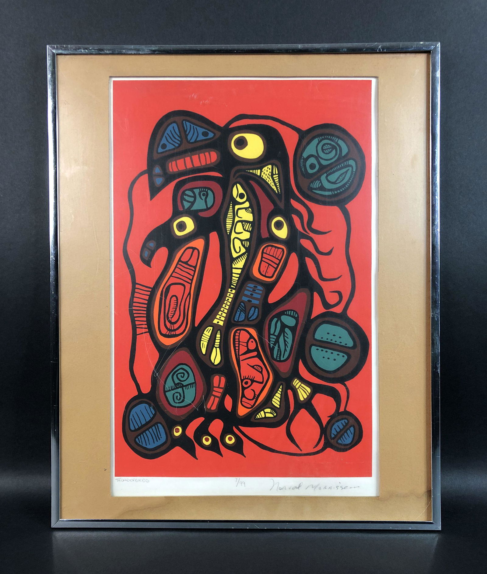 Norval Morrisseau (1932-2007) - Style of - Fine Art: This lot consists of a framed fine art print, done in the Indigenous Canadian style of Norval Morrisseau (Canadian, 1932-2007). Image depicts a splendid thunderbird design against a brilliantly colore
