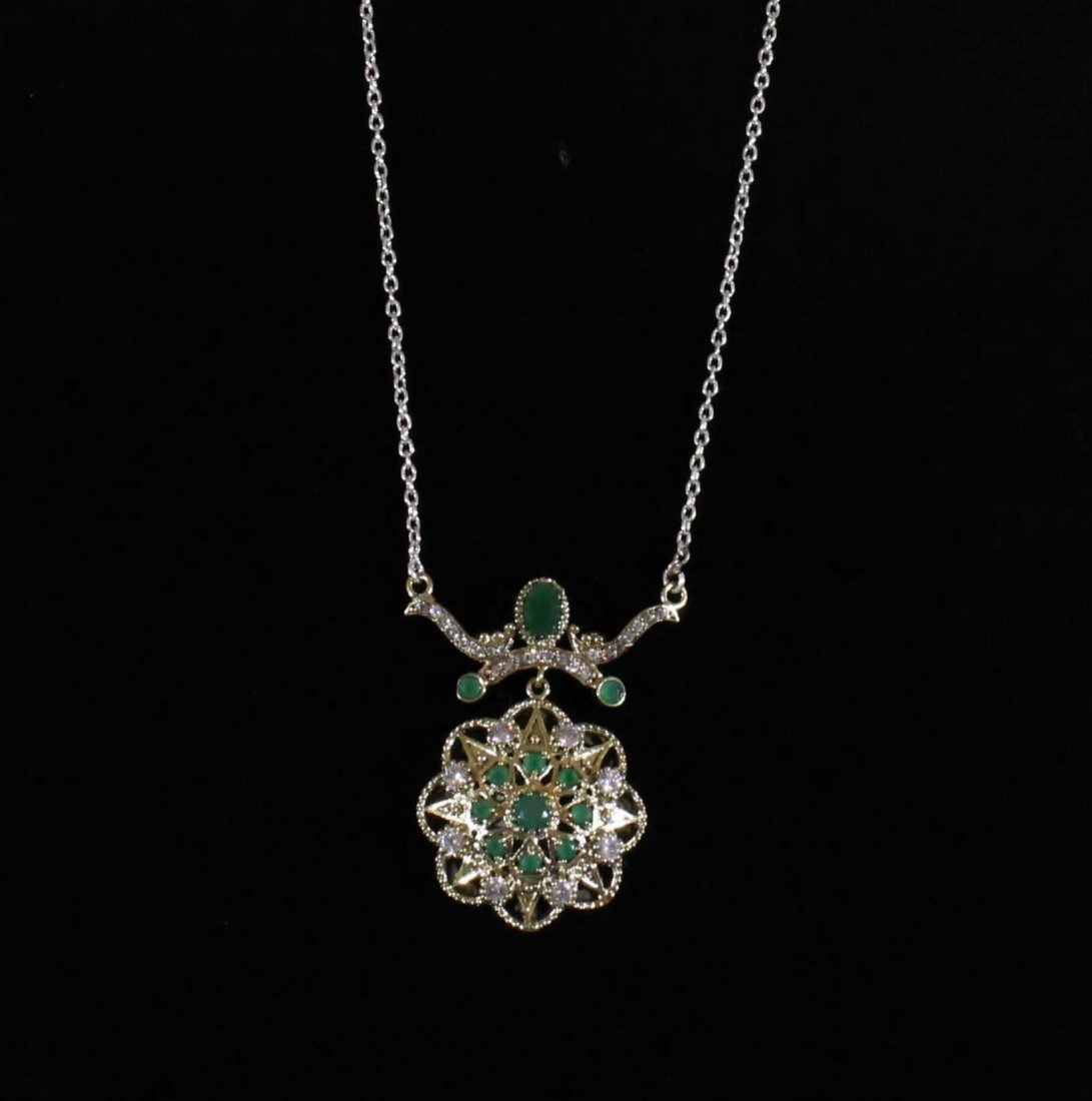 Victorian Imperial Star Pendant: Victorian imperial star pendant in sterling silver with gold fill, green onyx and fire faceted zircons. 17 inches neck length.