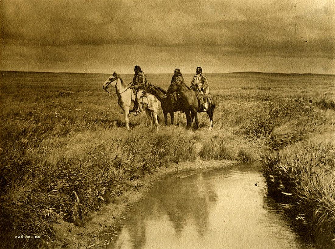 E. S. CURTIS, "The Three Chiefs - Piegan." Ca. 1900.: E. S. CURTIS, "The Three Chiefs - Piegan." Ca. 1900. 6 x 8 - inch unmounted platinum print on textured paper with the negative number in the print, and Curtis's blindstamp above it.