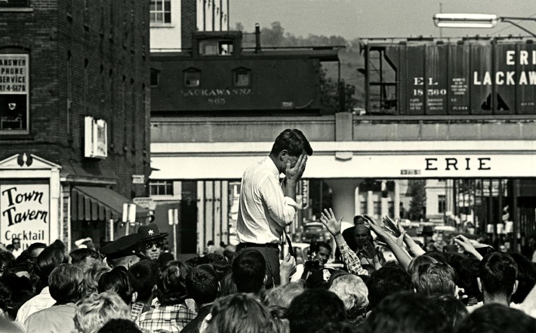 Cornell Capa, Robert Kennedy at a rally in Buffalo.: Cornell Capa, Robert Kennedy at a rally in Buffalo. 8 x 12 - inch image on an 11 x 13 - inch sheet, 1964, printed later. Capa's stamp on verso with his signature and "for reproduction only" in pen. He