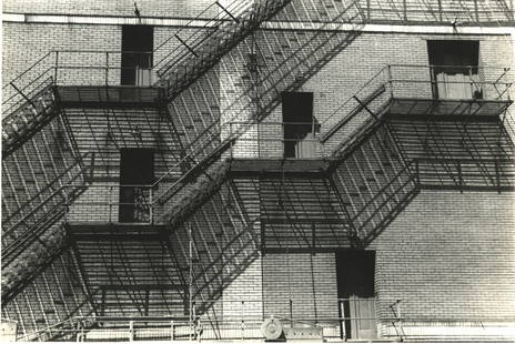 John Vachon, Fire escapes. FSA: John Vachon, Fire escapes. 8 x 13 ½ inch vintage gelatin silver print on single weight paper. This appears to be at the side of a factory. It is a rare abstraction in the F.S.A. photographic canon..