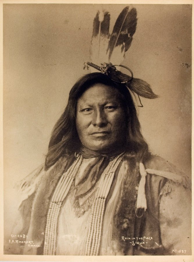 RAIN IN THE FACE (Ite Omagu), Hunkpapa Lakota.: RAIN IN THE FACE (Ite Omagu), Hunkpapa Lakota, by David F. Barry, at Standing Rock Reservation, D.T., late-1880s. Copied & sold by Rinehart. Unmounted 9 ¼ x 7 3/8 platinotype. “Copied by / F.A. Rin