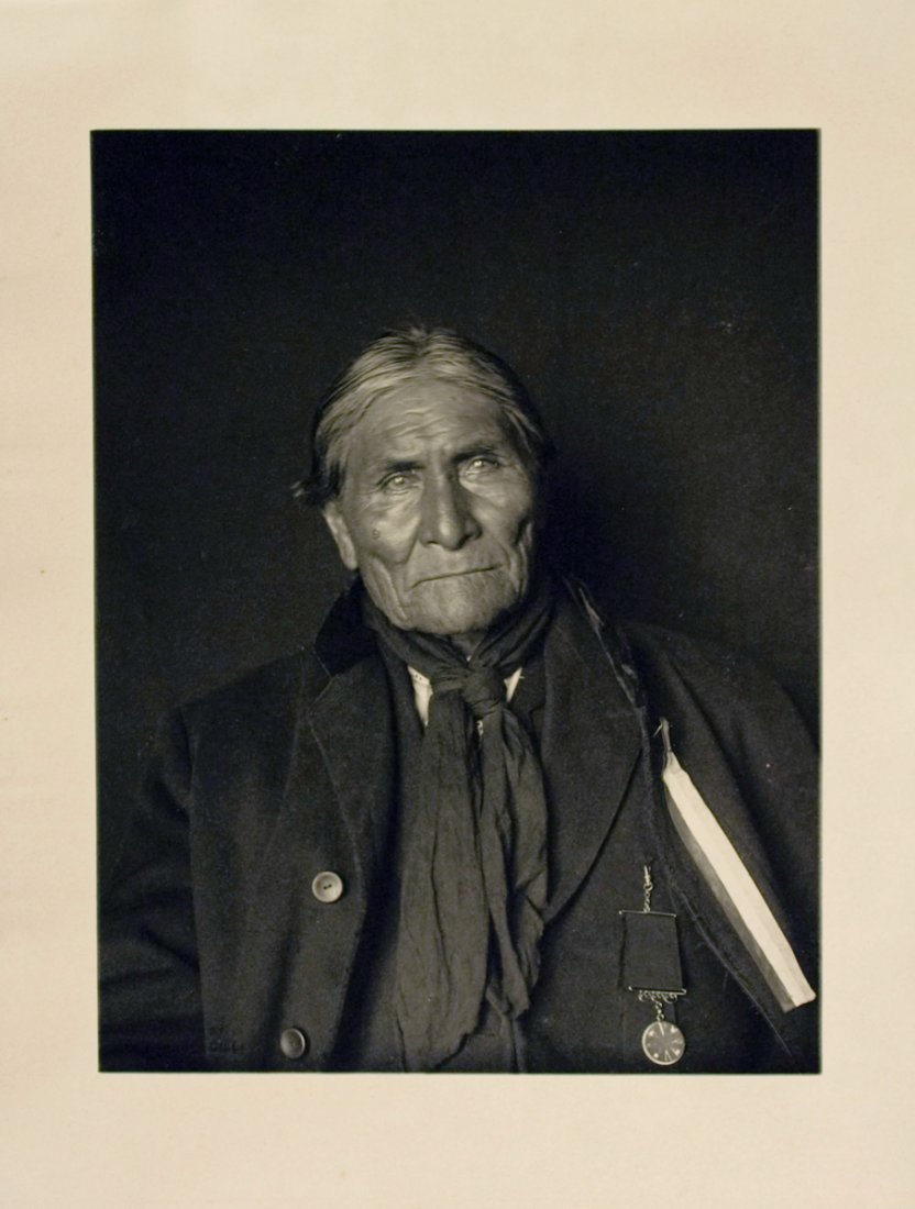 ONE WHO YAWNS (GERONIMO): ONE WHO YAWNS (Goyathlay), called GERONIMO, Chiricahua Apache, March 1905. NAA #gn_02506aby De Lancey Gill. 10 x 7 15/16 neutral-tone platinotype. “Negative by De Lancey Gill” stamped on image and