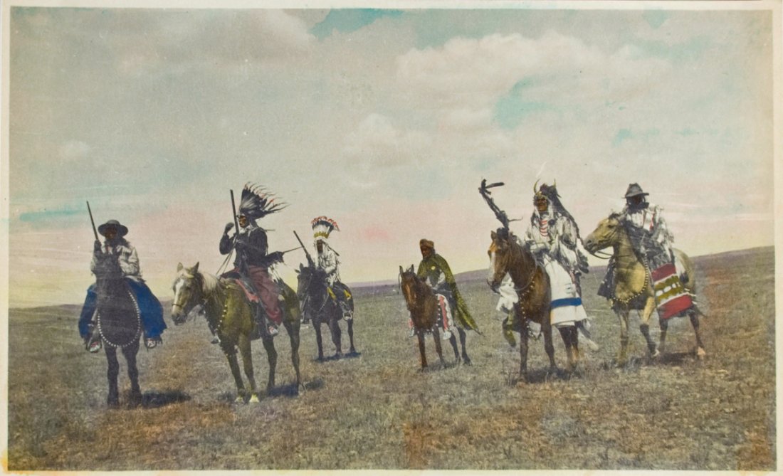 5 PHOTOS BLACKFEET, SOUTHERN ALBERTA.: 5 PHOTOS BLACKFEET, SOUTHERN ALBERTA. a) “In Full Regalia---Piegan.” Pikuni Blackfeet parading, sounthern Alberta, ca. 1905.A formal parade called the “Big Riding Dance,” with sham-battle re-e