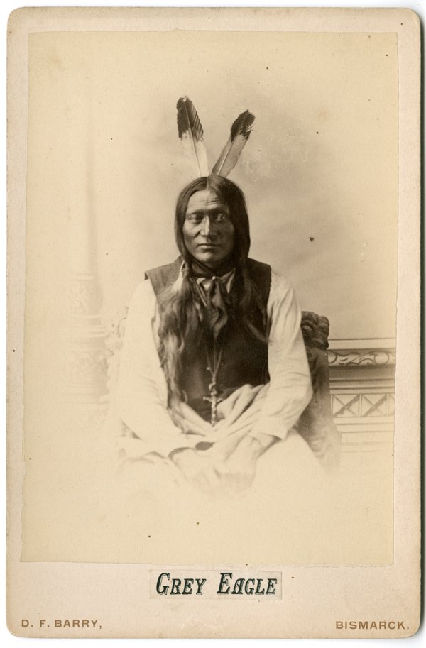 “GREY EAGLE,” CABINET CARD BY D.F. BARRY: “GREY EAGLE,” CABINET CARD BY D.F. BARRY, with Bismarck, N.D. backmark. The Hunkpapa Lakota (named Anunka San) was photographed at Fort Yates, D.T., May, 1883. Grey Eagle (literally, "white on bot