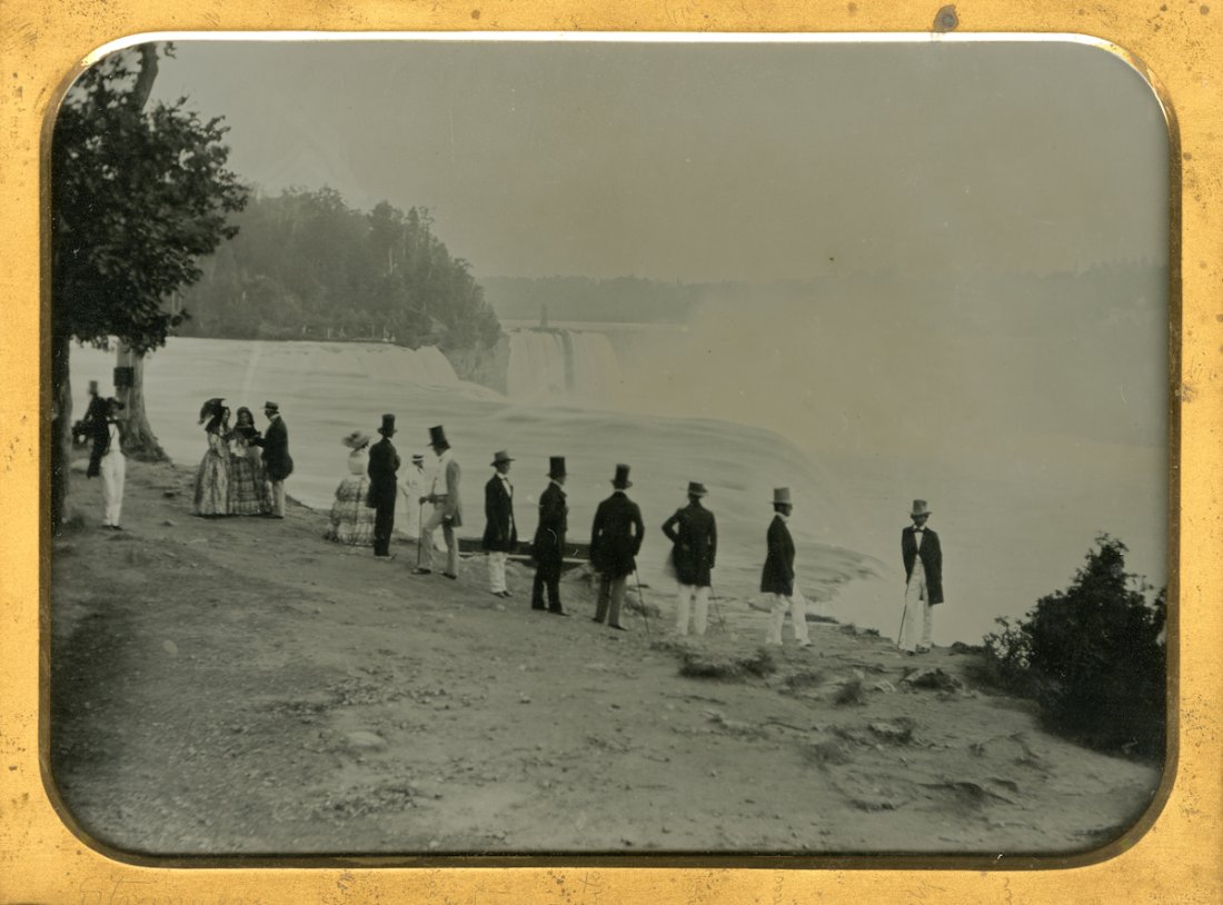 GROUP AT NIAGARA, BY BABBITT.: GROUP AT NIAGARA, BY BABBITT. Whole plate ambrotype in a full hinged case. There are a number of men in tall hats, some with black trousers, some with white ones, and ladies at the left. Only the man