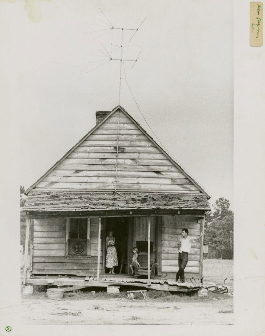 "NEAR CHARLESTON S.C." by ROBERT FRANK.: "NEAR CHARLESTON S.C." by ROBERT FRANK. 14 x 10 7/8- inch gelatin silver print, 1955. Signed on verso, with "Near Charleston/ S.C." in green pen on small label on right margin. No. "8" in a circle in