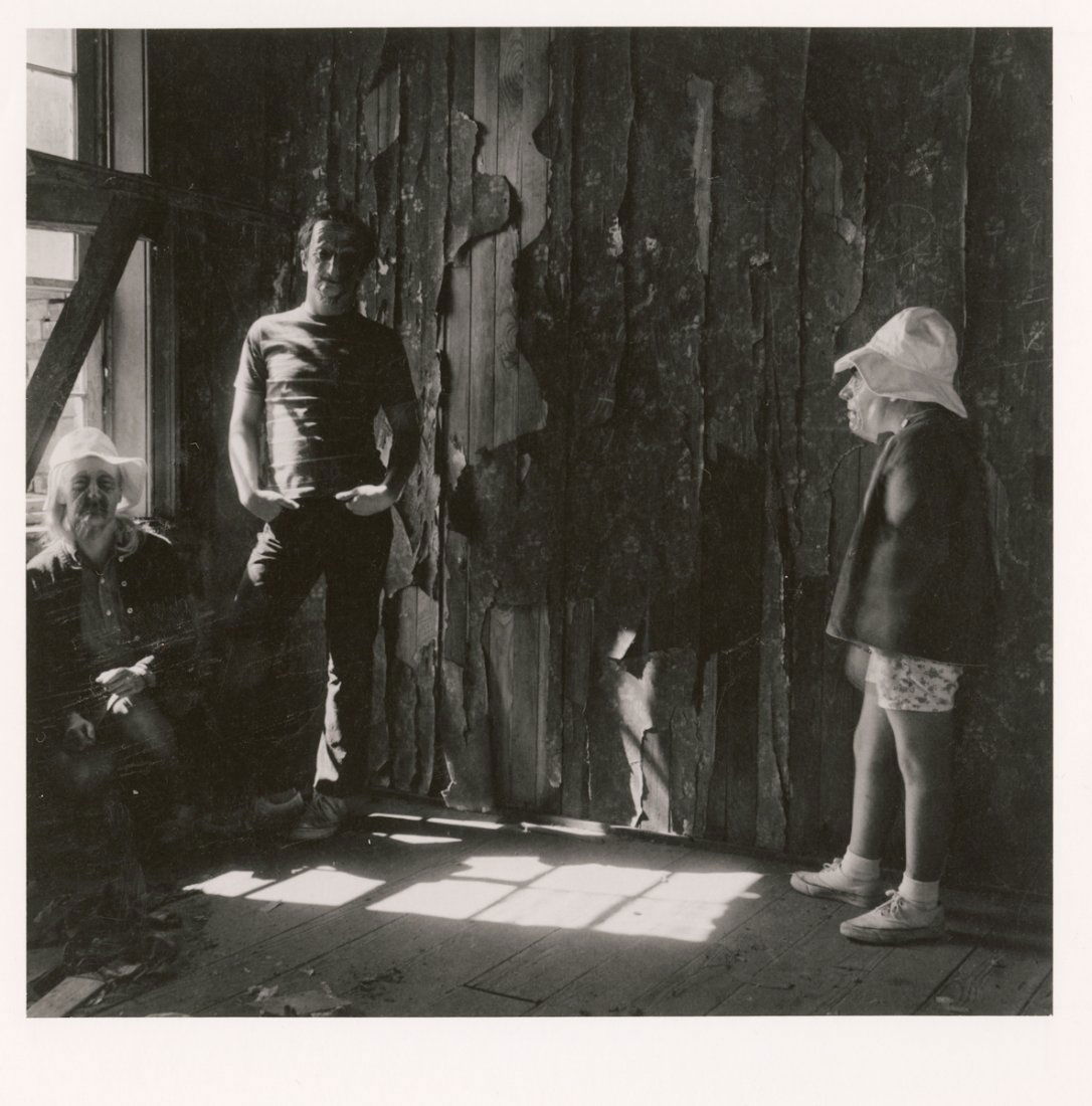 UNTITLED (BOY WITH OLD MAN'S MASK, 2 MEN) by MEATYARD: UNTITLED (BOY WITH OLD MAN'S MASK, 2 MEN) by Ralph Eugene Meatyard. 10 x 8- inch gelatin silver print, ca. 1960's, signed in pencil on verso. Markings on verso indicate the location of the picture on