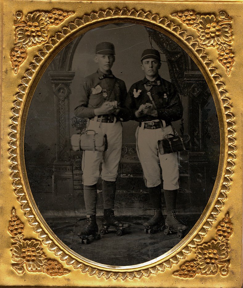 CHAMPION ROLLER SKATERS. 1/6 plate Tintype.: CHAMPION ROLLER SKATERS. They wear similar outfits. Similar bags are suspended from their shoulders. They have handkerchiefs protruding from their shirt pockets, and medals pinned to their chests. 1/6