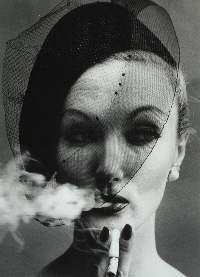 "SMOKE AND VEIL, PARIS (VOGUE) 1956" by William Klein.: SMOKE AND VEIL, PARIS (VOGUE) 1956" by William Klein. Signature, title and date in pencil on verso. 18 x 13 gelatin silver print, printed later. Matted and framed. Howard Greenberg Gallery label on ve
