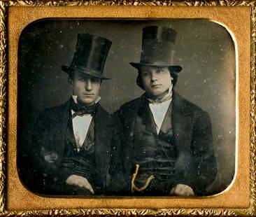 TWO MEN WITH TALL HATS, 1/6 PLATE DAGUERREOTYPE: TWO MEN WITH TALL HATS, 1/6 PLATE DAGUERREOTYPE, in half case with original seals intact. The chain of the man at right is gilded.