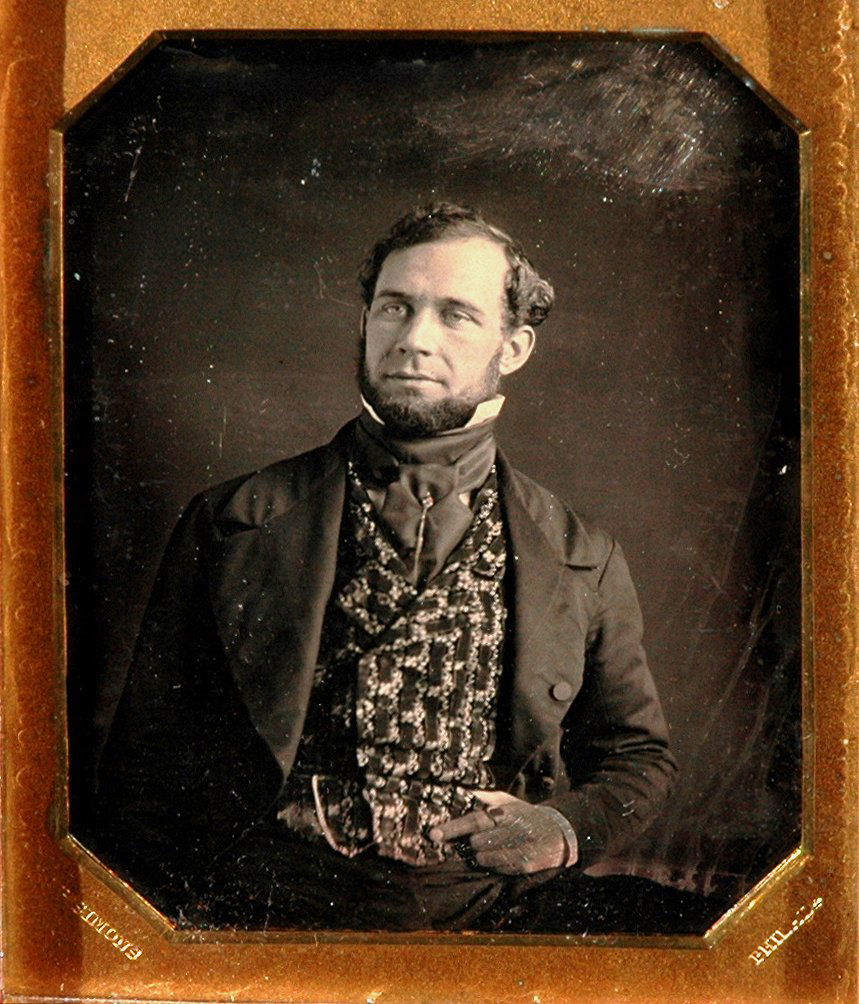 GENTLEMAN WITH FANCY VEST BY SIMONS. ½ PLATE: GENTLEMAN WITH FANCY VEST BY SIMONS. ½ PLATE DAGUERREOTYPE. A paper identifies the subject as Sam. C. Cook. "M.P. Simons" and "Philada" are stamped in the mat of the full hinged case. There are very
