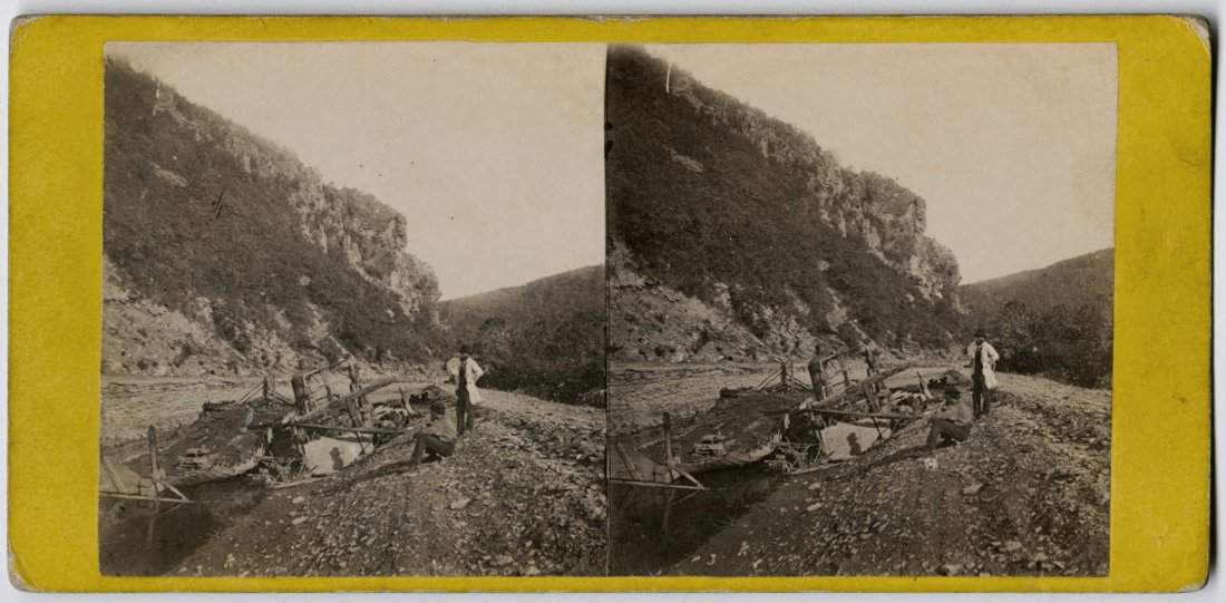 BRADY IN ANTHONY CIVIL WAR STEREO VIEW No. 945: BRADY IN ANTHONY STEREO VIEW No. 945, War Views. "View of Harper's Ferry, showing the Ruin wrought by War." There are two figures-- the standing one is Brady. Published by Anthony, 501 Broadway, on a 