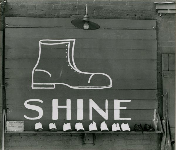 WALKER EVANS, “SHOESHINE STAND DETAIL...": WALKER EVANS, “SHOESHINE STAND DETAIL SOUTHEASTERN U.S. 1936." 7 x 8 - inch gelatin silver print, dry mounted, signed in pencil on the mat, recto, with “2/75.” This was printed under Walker’s
