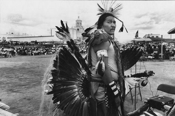 BRUCE DAVIDSON, INDIANS IN KANSAS, 1987.: BRUCE DAVIDSON, INDIANS IN KANSAS, 1987.. 5 5/8 x 8 - inch image matte gelatin silver print. Signed on the bottom margin, with dedication “To Ken – the biggest chief in the Kodak tribe.” A myste