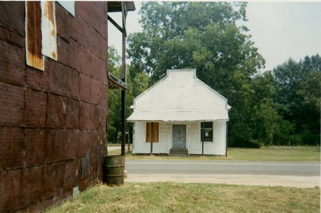 WILLIAM CHRISTENBERRY, “WAREHOUSE WALL AND STORE,: WILLIAM CHRISTENBERRY, “WAREHOUSE WALL AND STORE,5 5/8 x 8 - inch image on 8 x 10- inch Kodak Profession paper, C-print. Title and signature in pen verso, with “printed 1992. Lassiter collection.