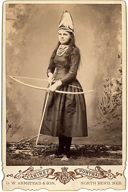 A woman archer in uniform.: A woman archer in uniform. “Grace Leith Smith” is written in pencil on verso. Cabinet by G. W. Armstead & Sons, North Bend, Nebraska.
