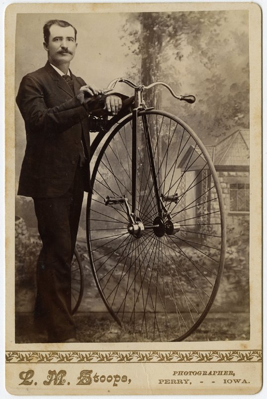 Three cabinet cards of men with high wheel bicycles.: Three cabinet cards of men with high wheel bicycles. a) A man in fancy dress by North, Bainbrdge.[4]. b) A man in uniform with “R.C.C.” on his cap. By Bo Durtha, Delaware, Ohio. [3+] c) A man on a