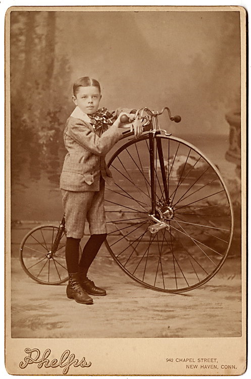 A boy with his high-wheel bicycle.: A boy with his high-wheeler. He’s identified verso and his age given as 9 years in September 1888. By Phelps, New Haven, Connecticut.