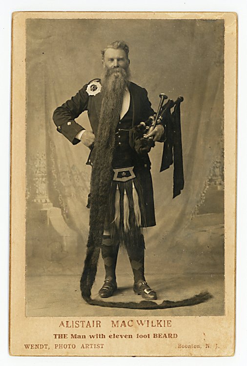 Alistair MacWilkie, “The Man with eleven foot BEARD.”: Alistair MacWilkie, “The Man with eleven foot BEARD.” He wears a kilt and holds a bagpipe. An extensive text on the verso gives advice on hair care. It sounds exactly like current ads and infomerc