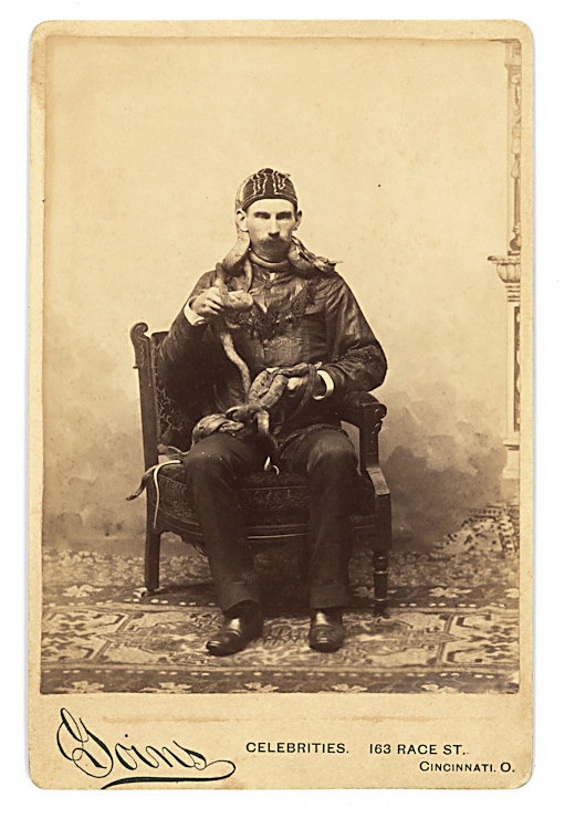 A snake charmer, with two or possibly three snakes.: A snake charmer, with two or possibly three snakes. Cabinet card by Goins, Cincinnati.