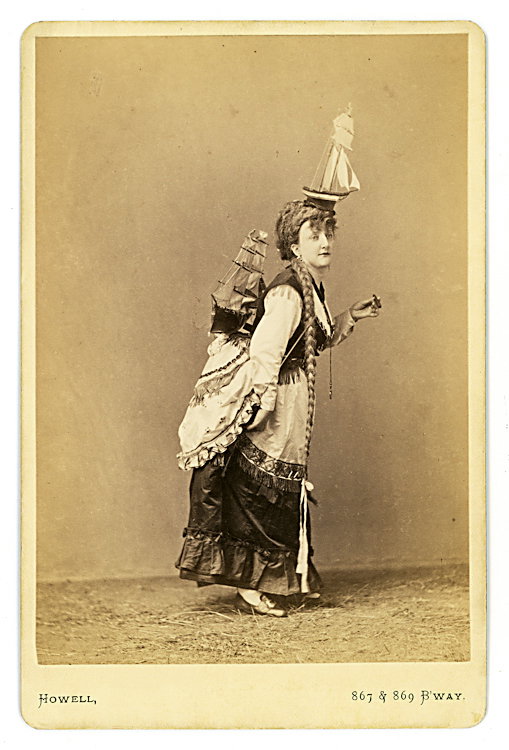 Emma Grattan, balancing act.: Emma Grattan, balancing act. She balances a sailboat on her bustle [see Lot 576] and the top of her head. Her identification is written in pencil on the verso of the cabinet card by Howell, NY.