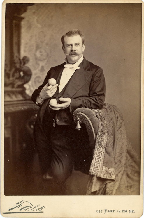 A finger billiardist Frank B. “Yank” Adams.: A finger billiardist Frank B. “Yank” Adams. The balls are manipulated by the fingers, without a cue stick. He is holding two billiard balls. By Falk, NY