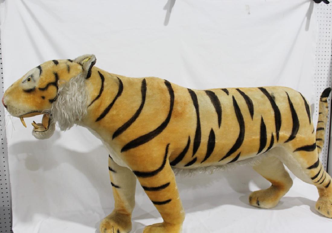 1950s Steiff Large Store Display Growling Tiger: large 1950s-60 Steiff Store Display Tiger, which growls; measures about 30 inches by 16 inches wide by 66 inches long (tail tucked in); has a few condition issues; growls well!