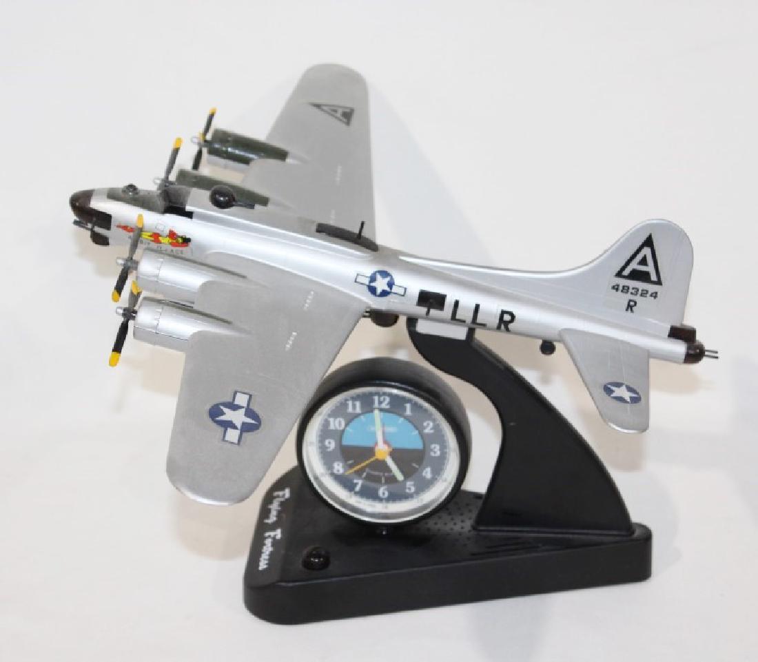B-17 Flying Fortress Model Airplane with Clock on Stand: nice B-17 Flying Fortress with clock on stand; measures about 9 inches tall by 18 inches wide