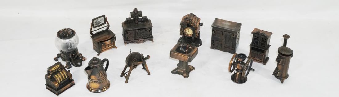 Vintage '70s Lot of Durham Metal Miniatures: Vintage Durham toys from the '70s includes cash register, stove, dresser, gumball dispenser, sink, cuckoo clock and more! Each measures approx 2â€-3â€