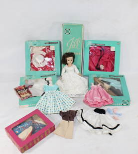 VTG 1957 Jill Doll w/ Box and Clothing Lot: Vintage 1957 Vogue Jill doll with original box and 10 outfits (some in original box) and rare cat eye sunglasses. Clothes may have small stains and or tears. Doll Approx 10" tall.