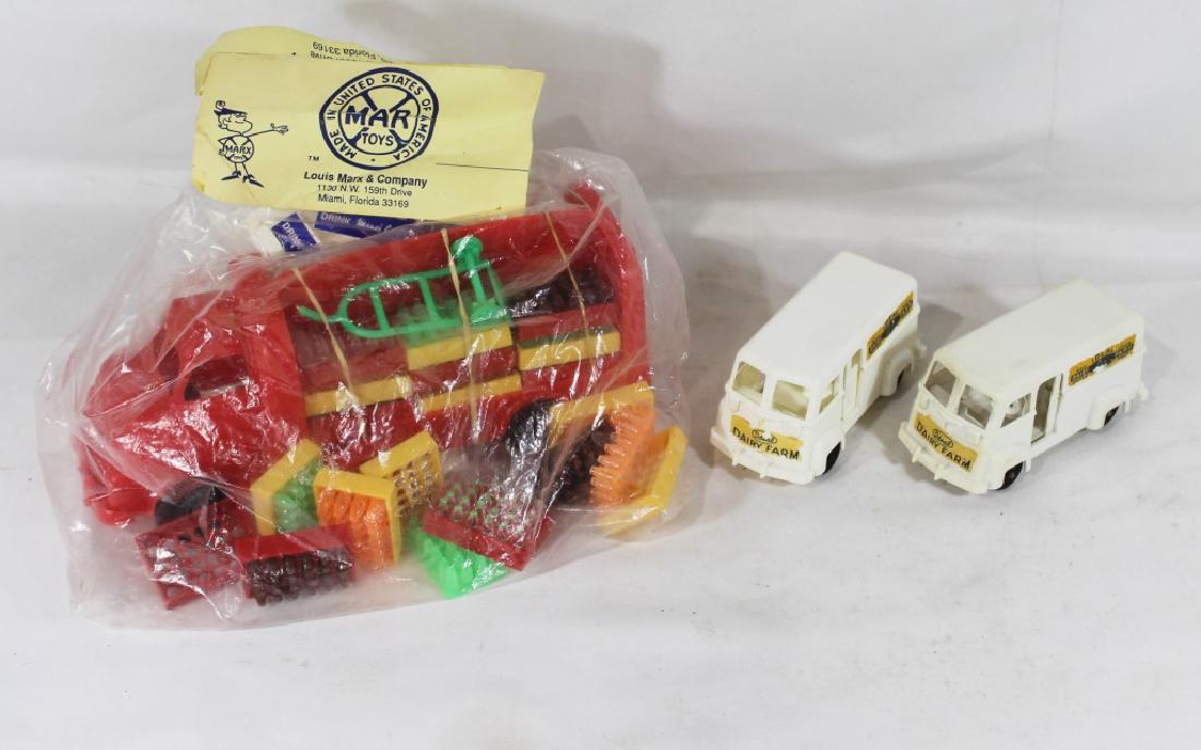 VTG Marx Bottle Toy Truck and IDEAL Toy Milk Trucks: Marx truck seems to be sealed in original packaging and includes the labeling stickers- approx 10.5" long and 3.5" tall . The IDEAL milk trucks measures approx 4.25" long and 2" tall- have some rust a