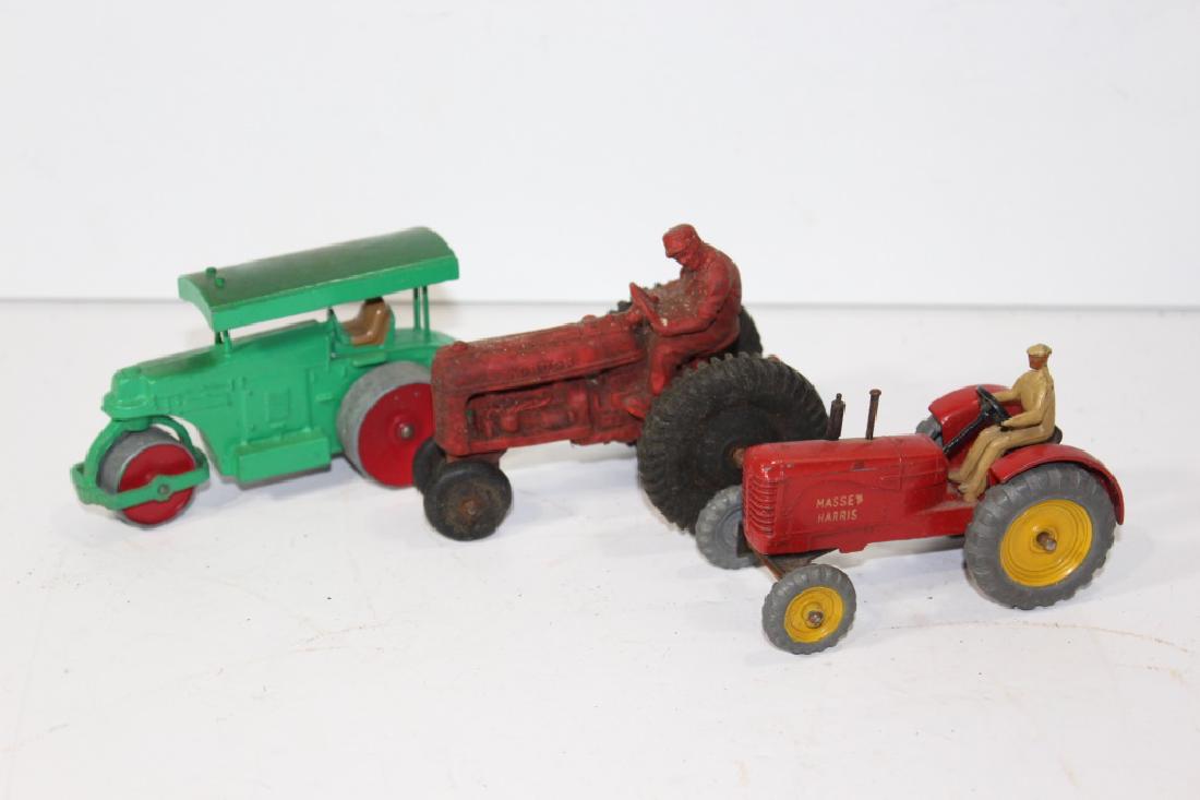 Lot of three vintage tractor toys: Dinky, Auburn, Massey Harris-Some wear and tear/minimal rust-All cars are roughly 4.5 long and 2.5 high.