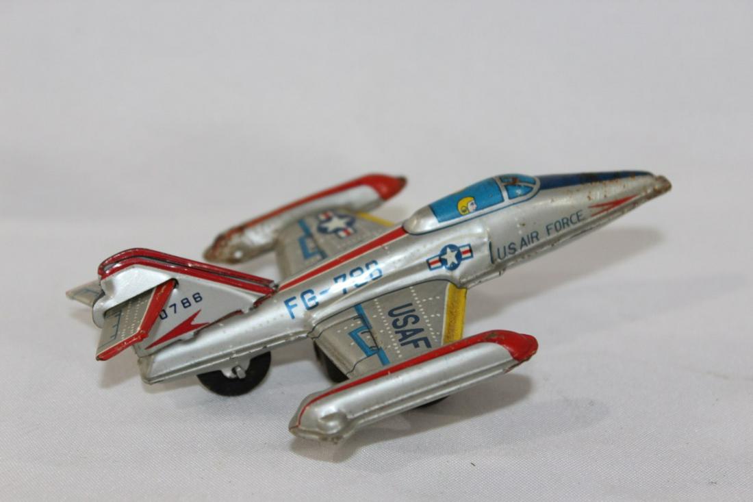 Vintage 50's Tin Toy USAF Plane: Vintage 50's Tin Toy USAF Plane-Roughly measures 4.5 inches long and 2 inches tall