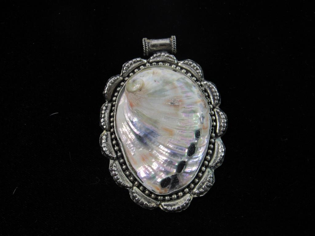 Nice Seashell Pendant with Decorative Metal Trim: measures about 3 inches long by 2 inches wide