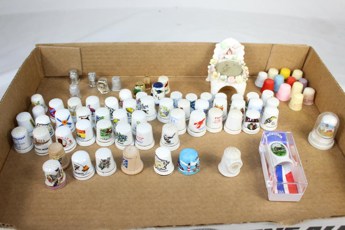 Misc Lot of Thimbles & Sewing Items: Some metal, ceramic and plastic thimbles and pink cushion as pictured