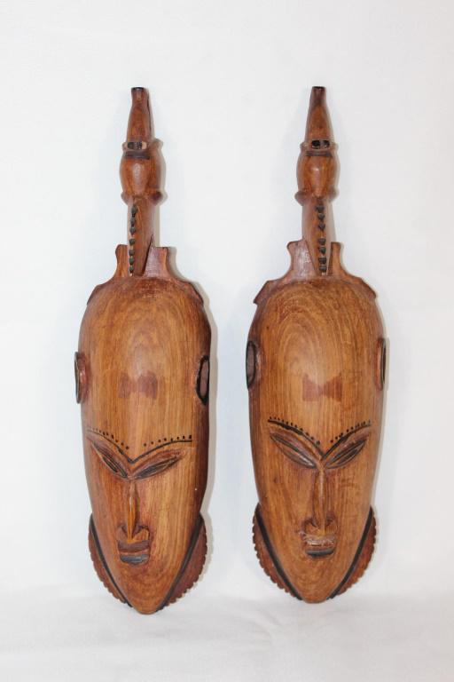 Pair of Carved Wood African Masks: Pair of carved wood masks - africa? with what appears to be an animal head on top, measures about 13 inches long by 3 1/2 inches wide