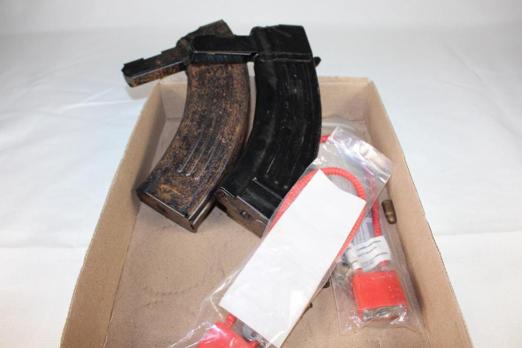 Pair of Large Magazines & Gun Locks: pair of banana clips and gun locks