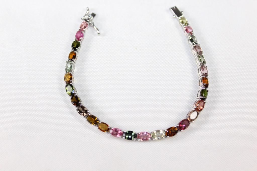 Natural Tourmaline Tennis Bracelet 12.35 CTW: Sterling and stainless tennis bracelets with natural tourmaline jewelry, measures about 7 1/4 inches long; Rhodium over sterling silver - 12.35 CTW
