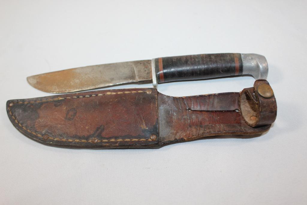 KNIFE AND LEATHER BELT SHEATH Boy Scout Stamp: MEASURES APPROX. 9 INCHES LONG- BLADE IS 5 INCHES LONG- NEEDS CLEANED AND SHARPENED- LEATHER SHEATH IS WORN HAS STAMP THAT READS NEW YORK & AFRICA? with boy scout stamp AS PICTURED