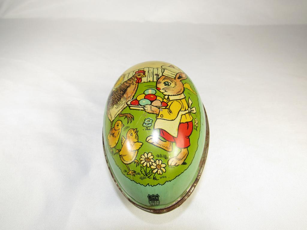 J.. Chein Metal Easter Egg: good overall condition, minor paint loss in places as pictured, measures about 5 inches long