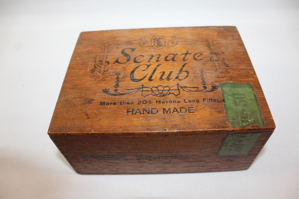 VINTAGE WOODEN SENATE CLUB CIGAR BOX: METAL HINGES/DOVE TAILED CORNERS- MEASURES APPROX. 3 BY 7 BY 6 INCHES. AS PICTURED