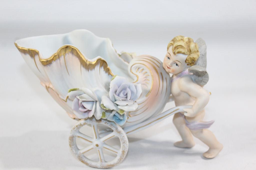 VINTAGE CHERUB/ANGEL PUSHING FLOWER CART PLANTER: MEASURES APPROX. 4.5 BY 7 BY 4 INCHES. AS PICTURED